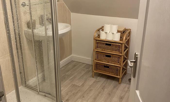 Shower Room linked to King Size bedroom. 1st Floor, 1000mm quadrant shower, basin and WC.
